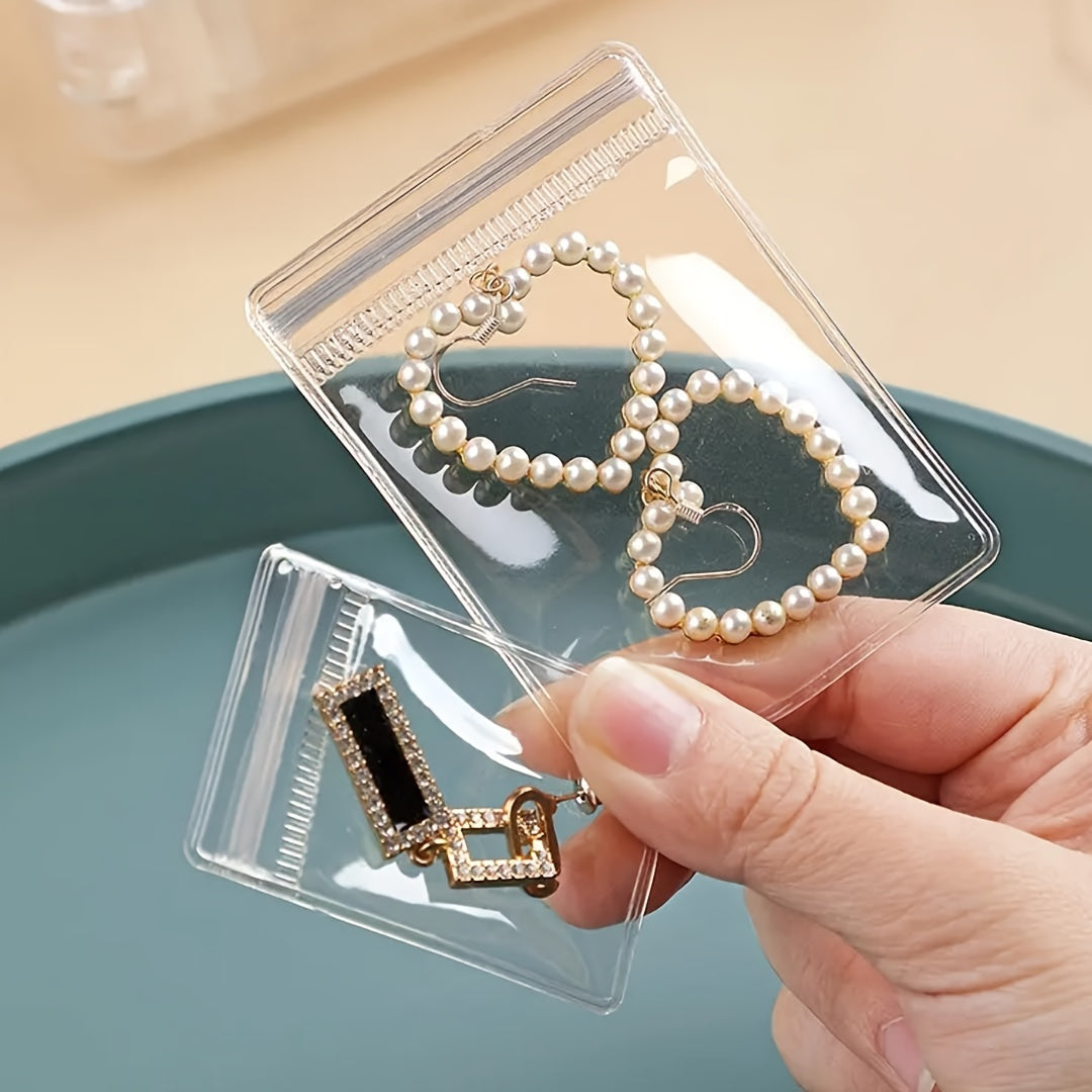 Enhanced product title: Pack of 100 Clear Resealable Anti-Aging Jewelry Bags - Self-Sealing Zipper Pouches for Convenient Storage and Organizat